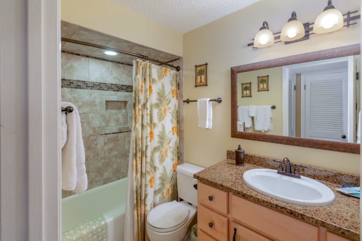 Shower, tub, and granite vanity in the 2nd bath