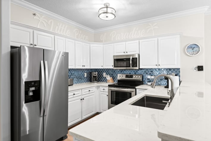 New quartz tops, new backsplash, sink/faucet, stainless appliances