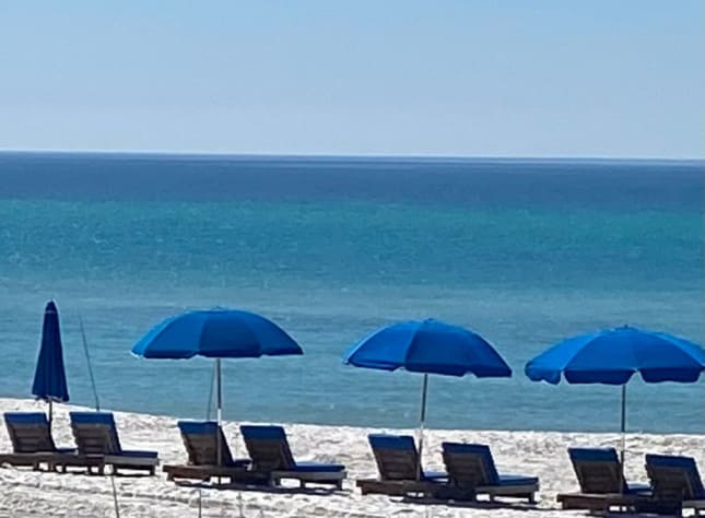 Set of 2 chairs &amp; umbrella beach service included with your stay!