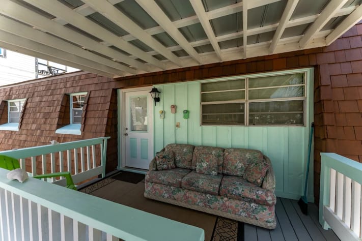 Sitting area on back porch. Hang out while grilling, updated to a glider bench