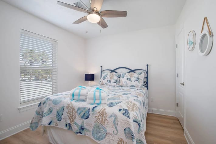 2nd floor queen bedroom with 32&rdquo; smart tv, chest and closet. 