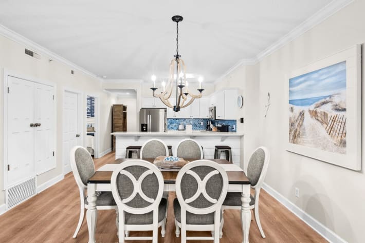 Cushioned Dining Chairs and Positioned Between The Kitchen &amp; Living Room.