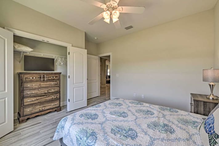 The Tropical Sunrise Room features a queen bed and smart TV