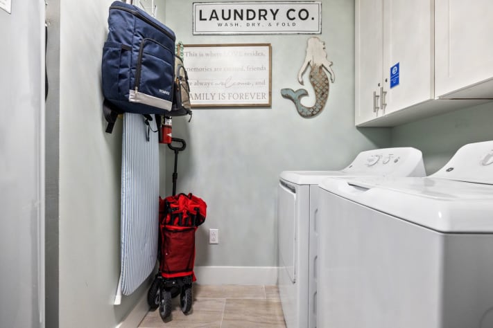 Laundry room with washer and dryer. Wagon for the beach.