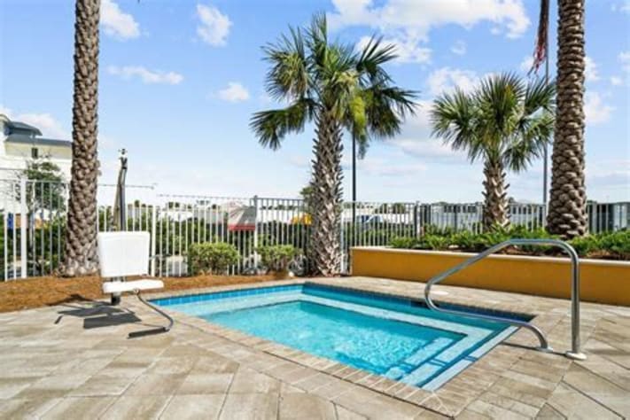 Huge hot tub, fire pit and relaxing lounge area.
