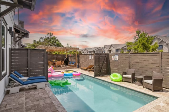 Enjoy a large 30ft pool that spans both sides of the house