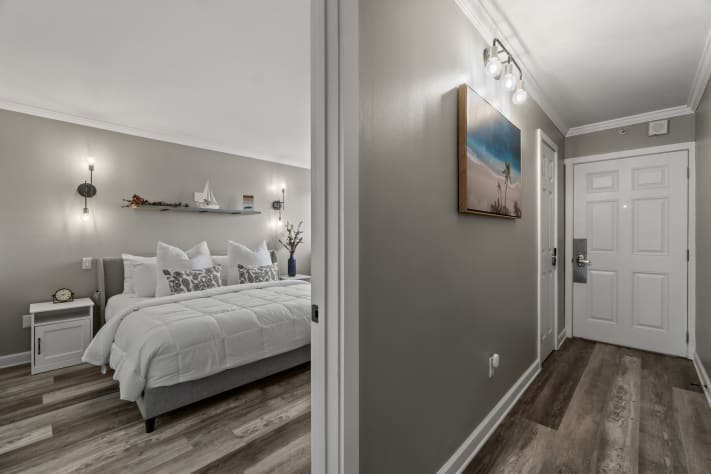 Hallway to bedroom, common area, living room, and bathroom