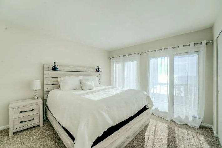 Master bedroom with ocean and swimming pool view 