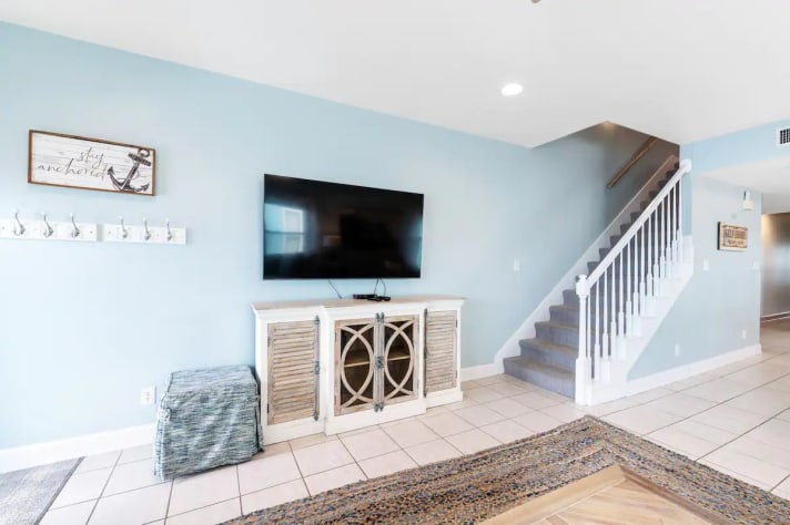 Living room showing the staircase