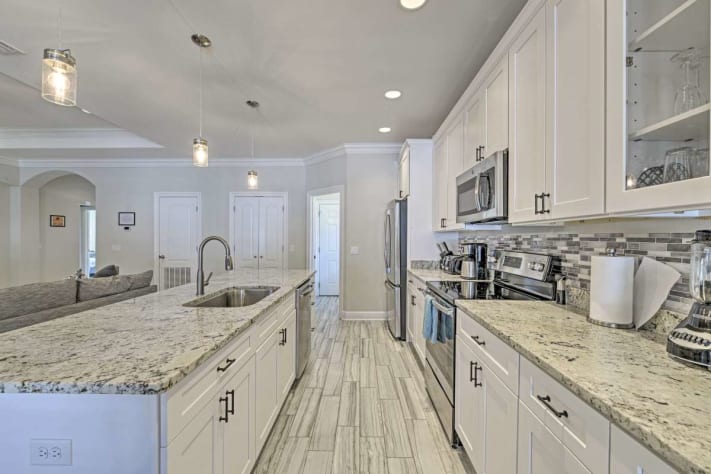 The kitchen has plenty of room for gathering and food prep or dining