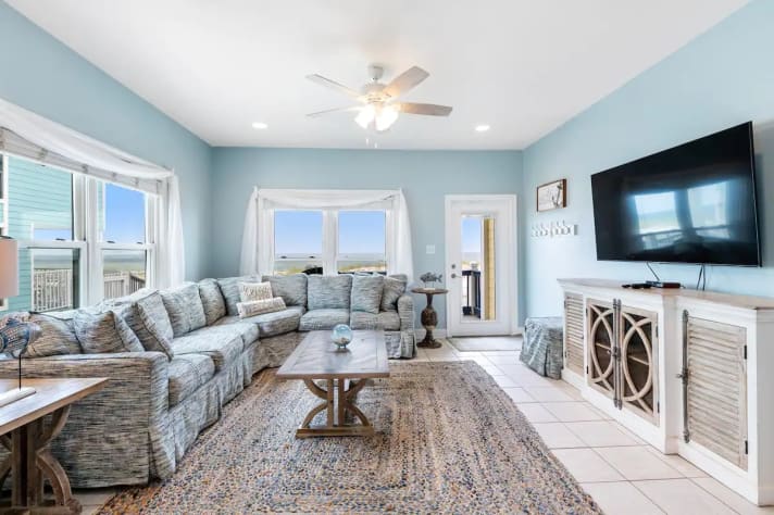 Living room with TV and ceiling fan