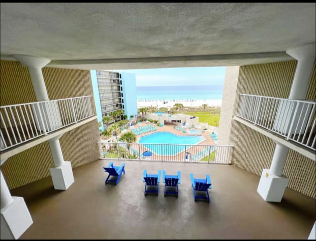 Balcony, overlooking pool and water