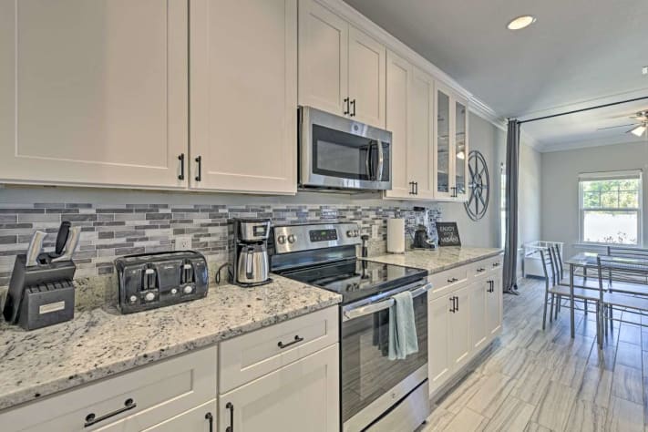 The kitchen has plenty of room for gathering and food prep or dining