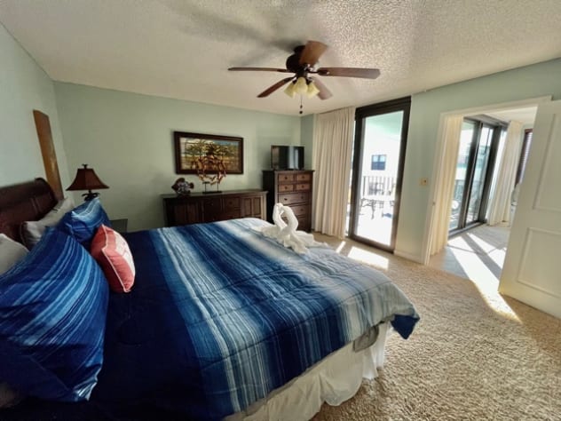 Master Bedroom with Sliding Doors to Balcony and Door to the Living Room