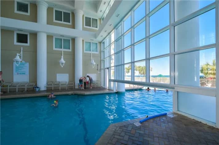 Indoor heated pool with swim out to the outside pool