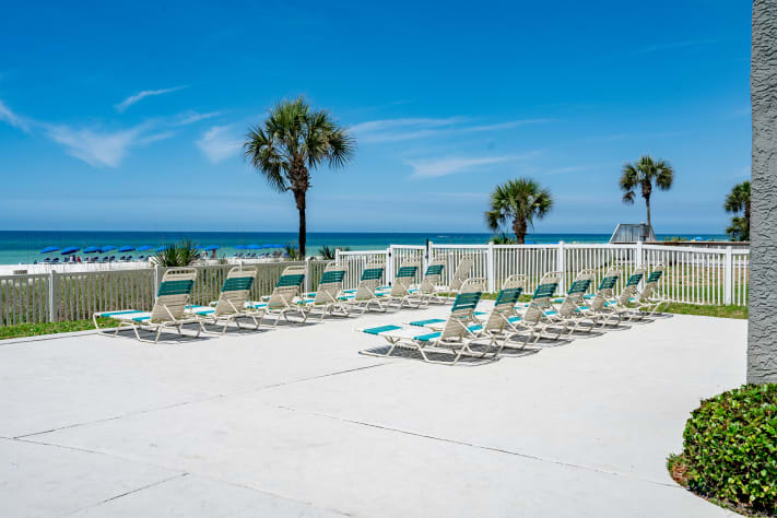 Plenty of chairs at pool and 2 reserved chairs w/umbrella on beach.