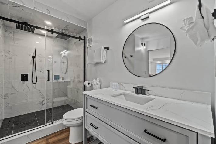 Large bathroom with dual rainfall shower heads