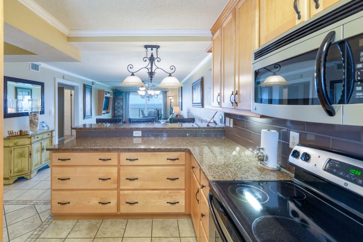 Closeup of the custom cabinetry and granite countertop in kitchen