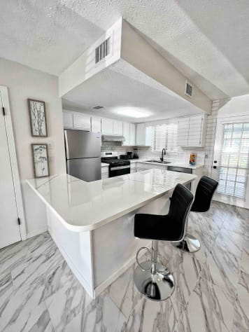 Fully - equipped kitchen , all new appliances 