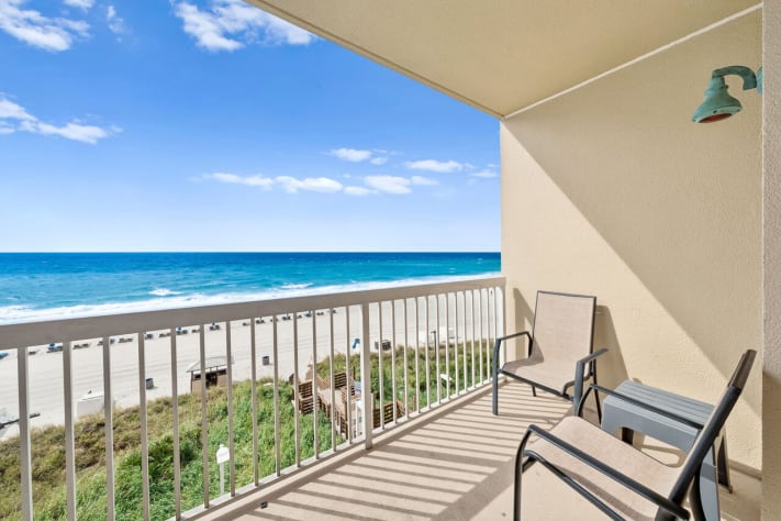 Private Gulf-front balcony with seating and unobstructed beach and ocean views