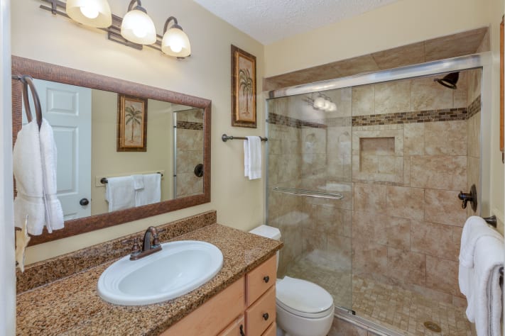 Walk in shower and granite vanity top add to the beauty of the master bath