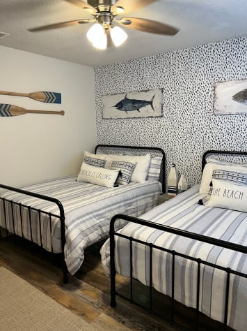 two queen beds in the second bedroom