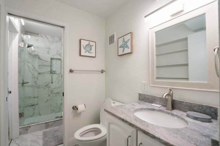Full bathroom with a new shower 