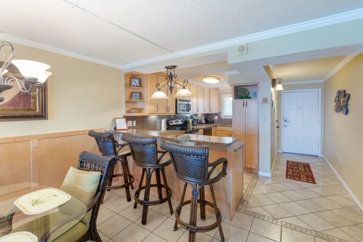 Dining area with additional seating at kitchen counter