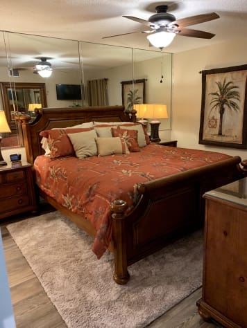 Master bedroom with a king bed