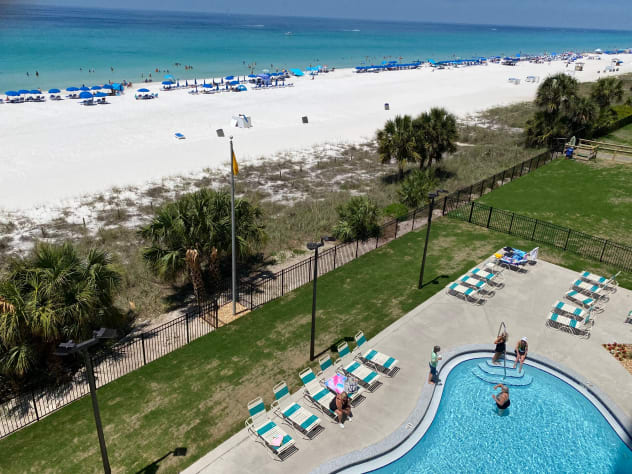 Balcony Overlooking 1 of 2 Heated Pools and Jacuzzis - Minutes from the Condo