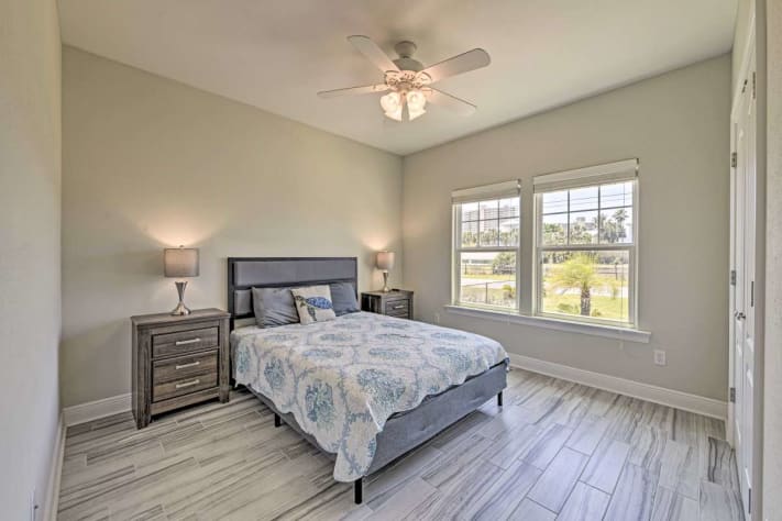 The Tropical Sunrise Room features a queen bed and smart TV
