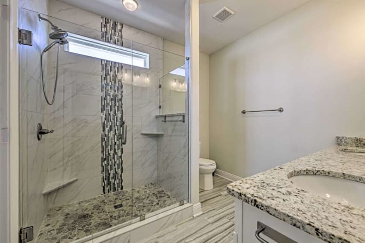 The Executive Suite bathroom features a shower, bidet, and walk-in closet