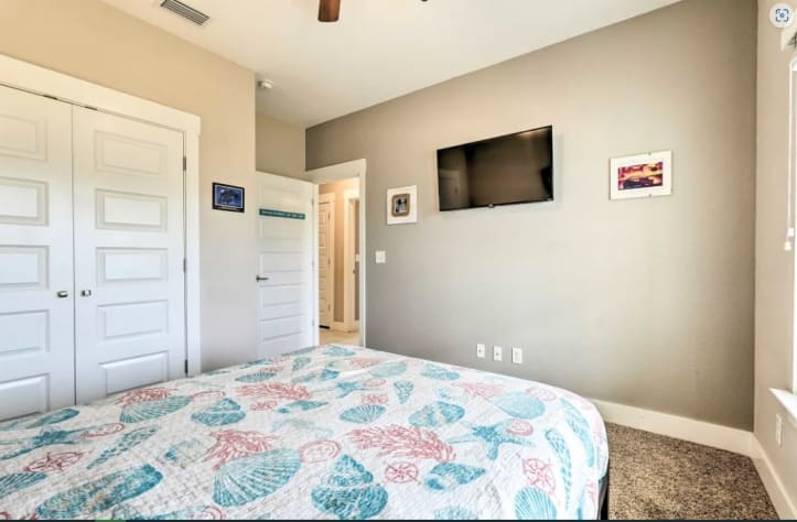 The Enchantment Of The Sea room has a queen bed and smart TV