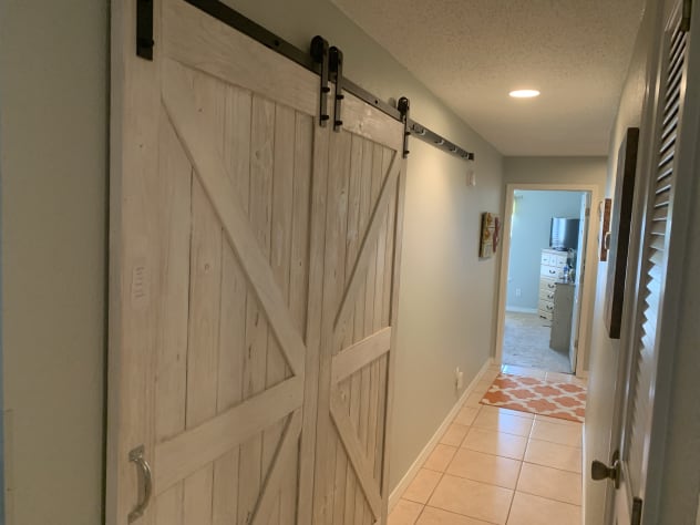 Hall with Barn Door for Washer and Dryer
