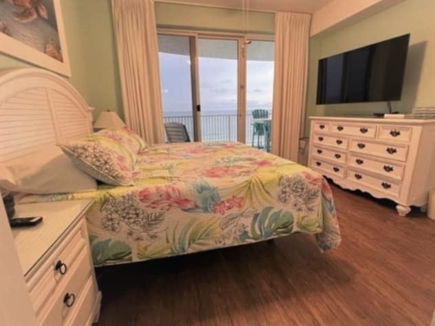 Master bedroom with adjustable 55" Smart HDTV with Roku