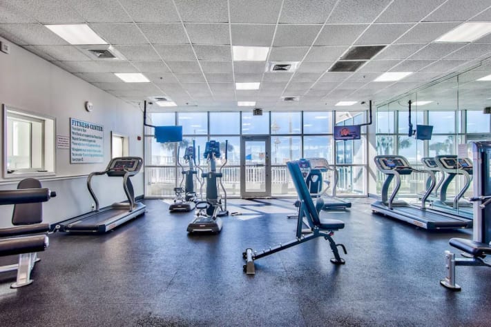 Large fitness center at Majestic Sun with Pool and Gulf view