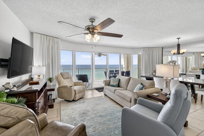 Living Room/Dining Room with floor to ceiling views of the Gulf.  Free WIFI and Direct TV plus Roku.