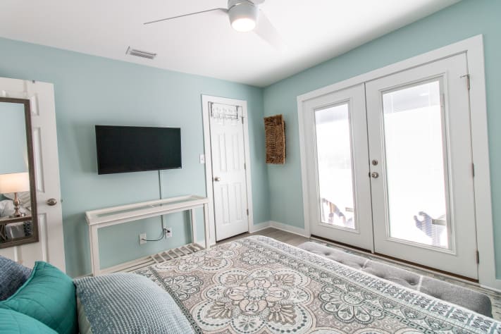 Sanddollar #13 - Master Bedroom with smart TV and access to patio