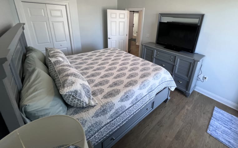 Bedroom 3 -King Bed 55" Smart TV with balcony access, new flooring