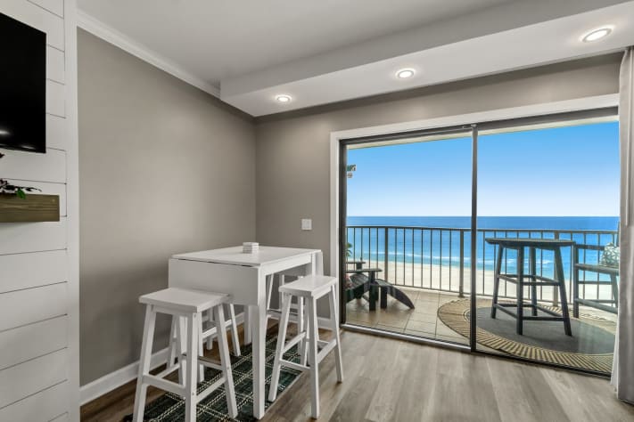 Large living room with entertainment center and dining, amazing view