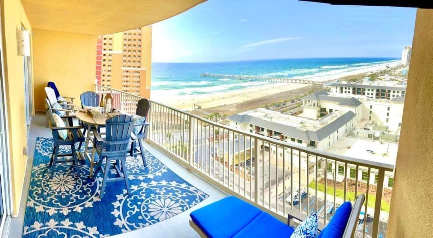 Balcony has pub table with 4 chairs, two lounge chairs, &amp; 2 Adirondack chairs
