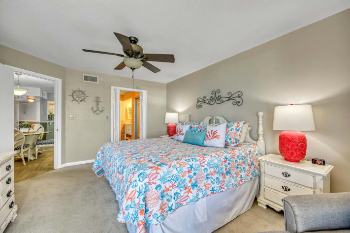 King size bed in Master bedroom and door leading to master bath.