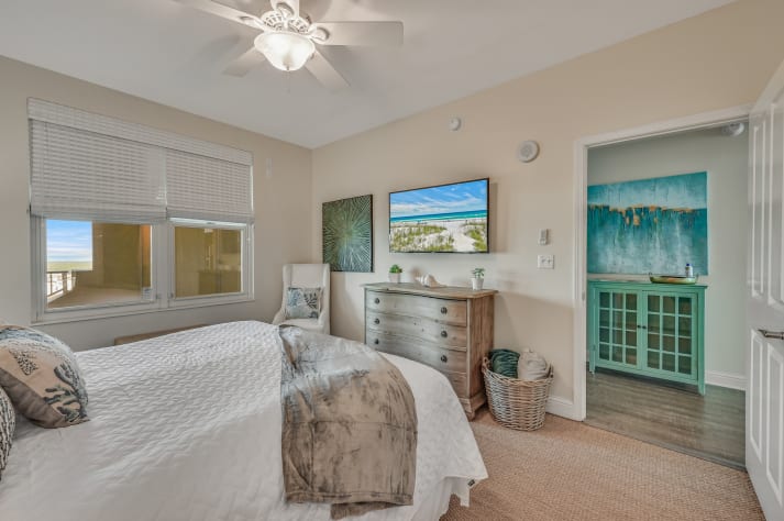 The master bedroom is spacious and tastefully decorated with a King bed, closet, 50" Smart TV mounted on the wall, and large bathroom with dual vanity and WALK-IN shower!