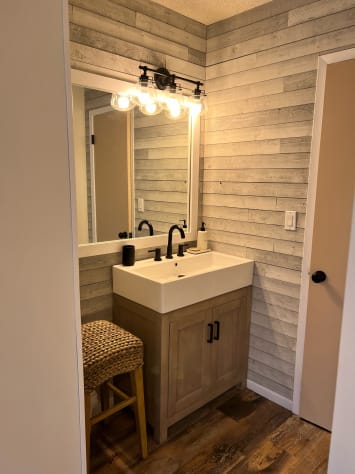 vanity area in main bedroom, bathroom is through the door