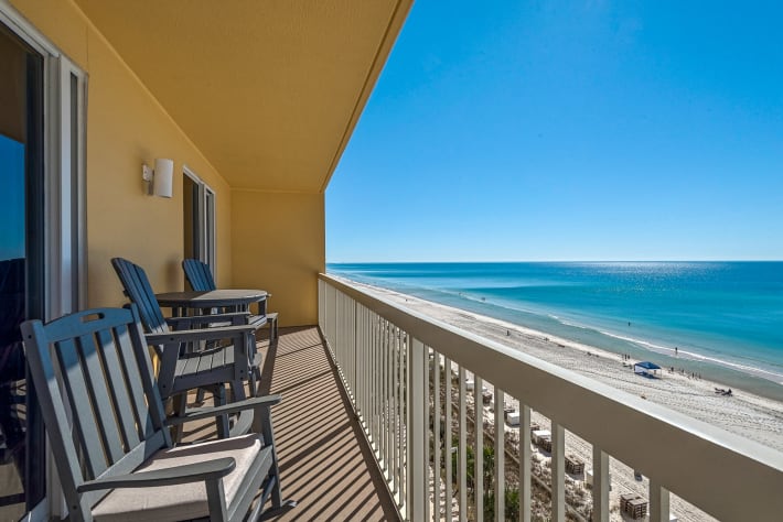 balcony has Polywood furniture with deep seat rockers and 2 bar height chairs