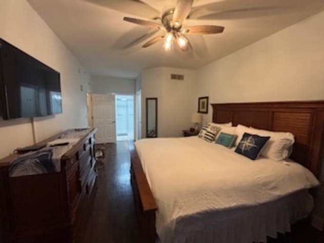 Spacious Master Bedroom with big flat screen TV.
