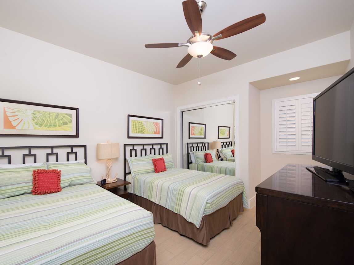 Third bedroom is equipped with 2 full size double beds, TV and private bathroom