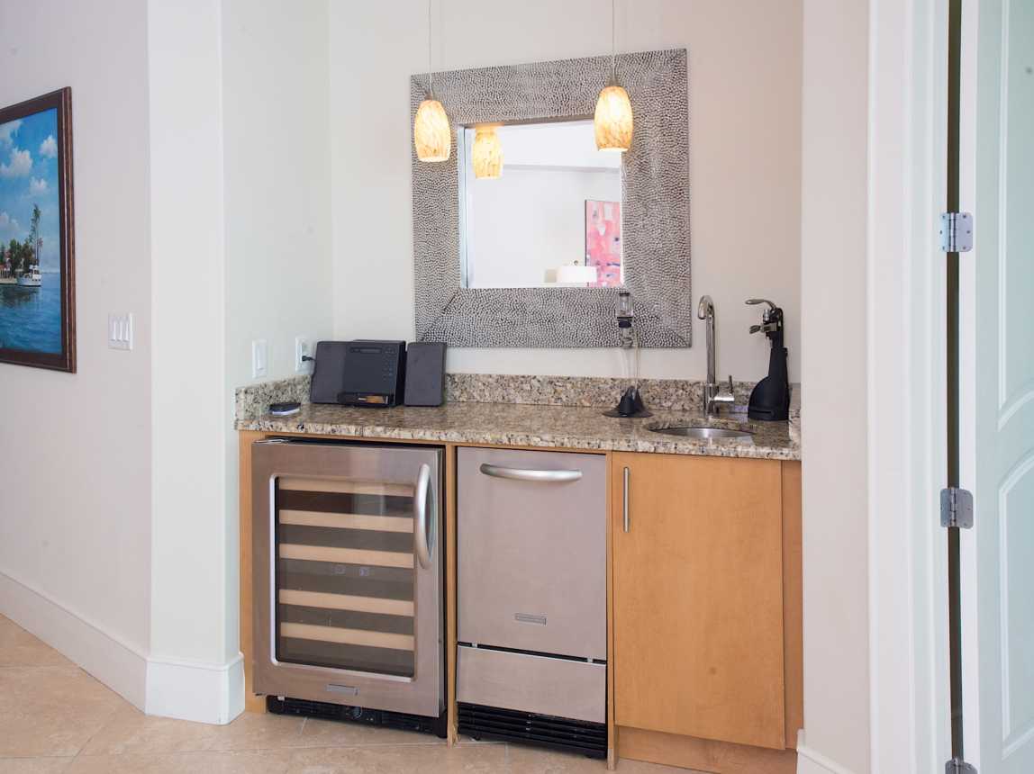 Wet bar equipped with wine fridge, ice maker and mini fridge!