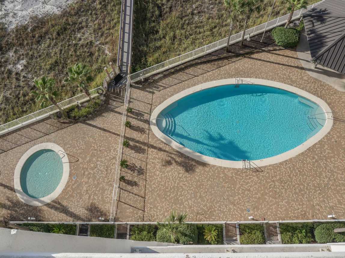 Kiddie pool &amp; beach front swimming pool with covered gazebo &amp; restrooms from balcony.