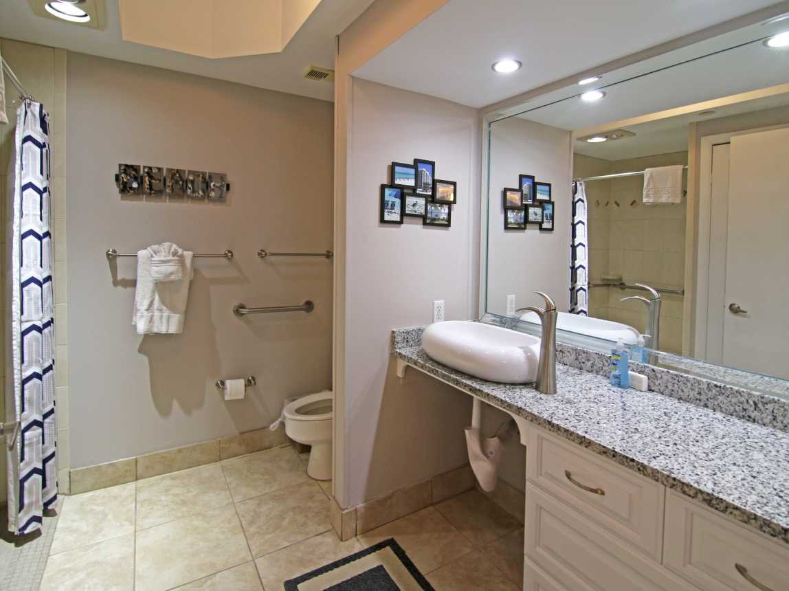 Large Master bathroom with roll-under sink access.